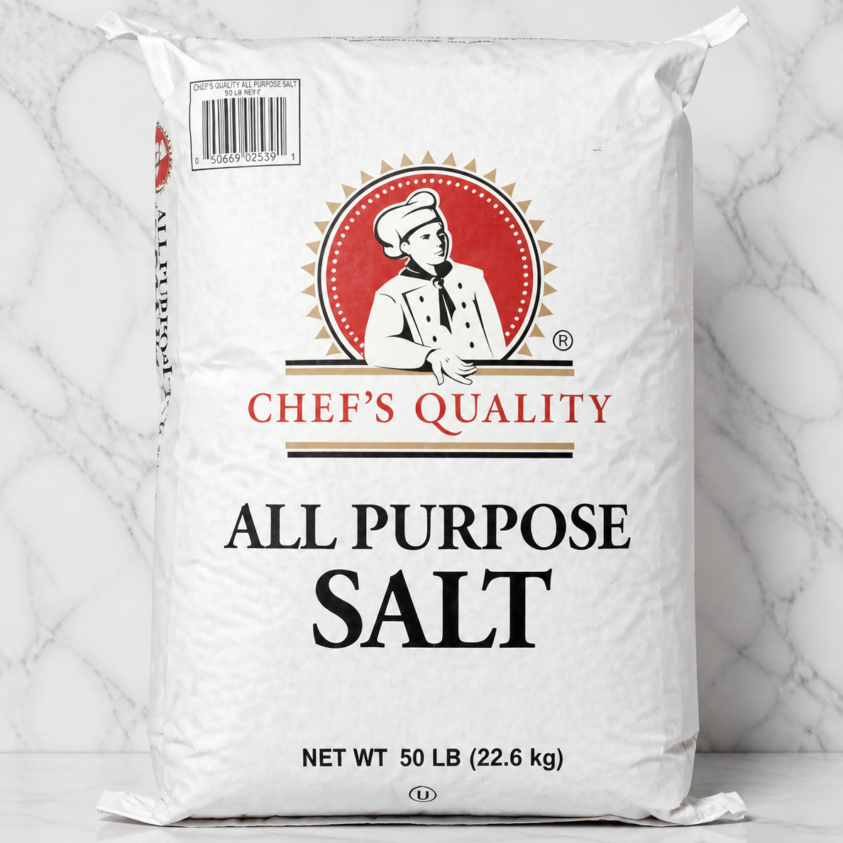 Bag of Chef's Quality all-purpose salt on a marble background