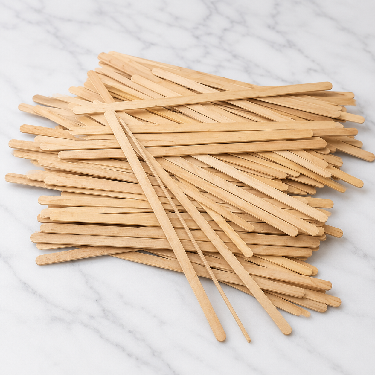 Stack of wooden sticks on a marble surface
