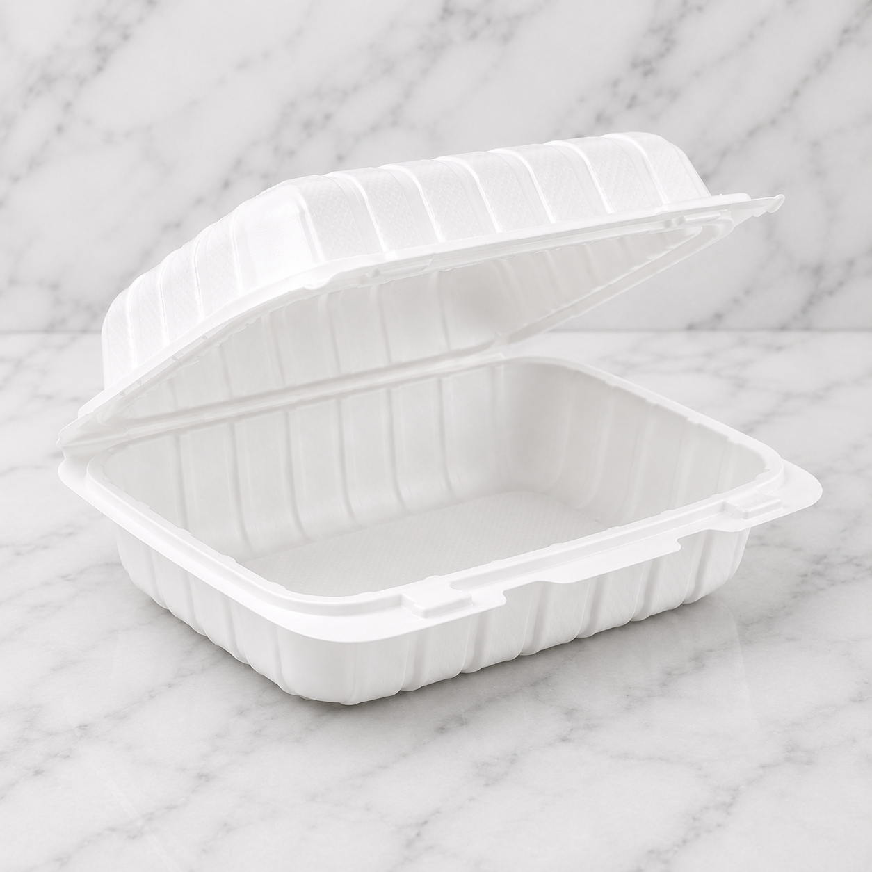 Two white disposable food containers with lids on a marble surface