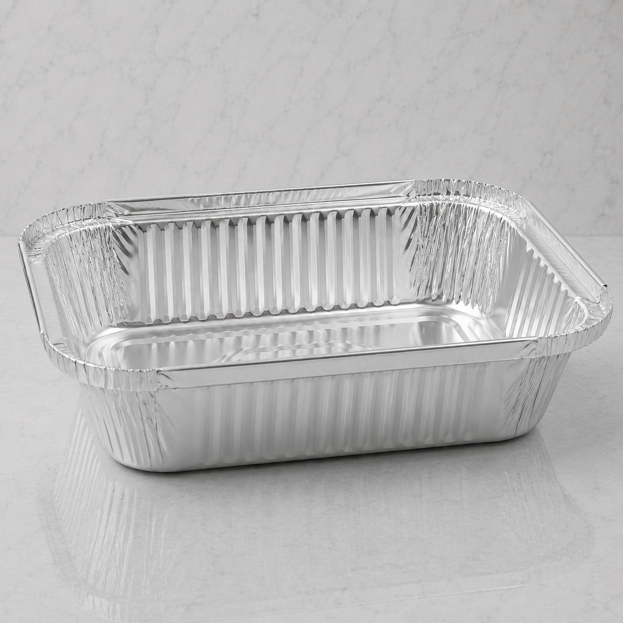 Aluminum foil food container on a gray background