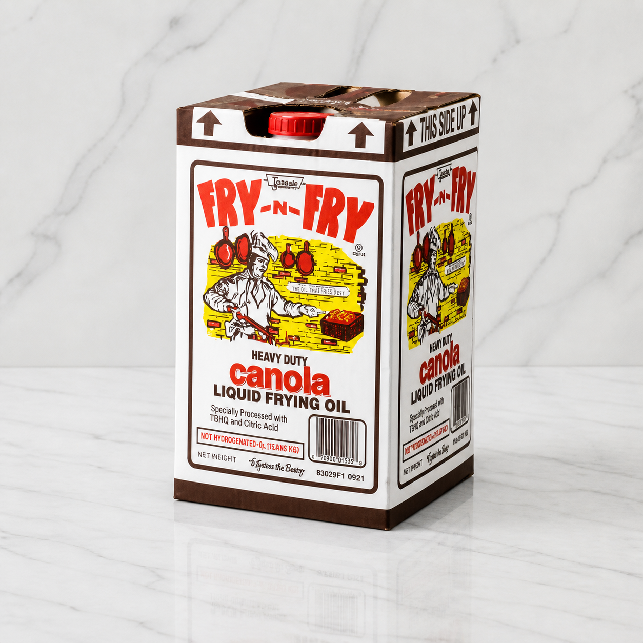 Box of Fry-N-Fry canola oil on a marble surface