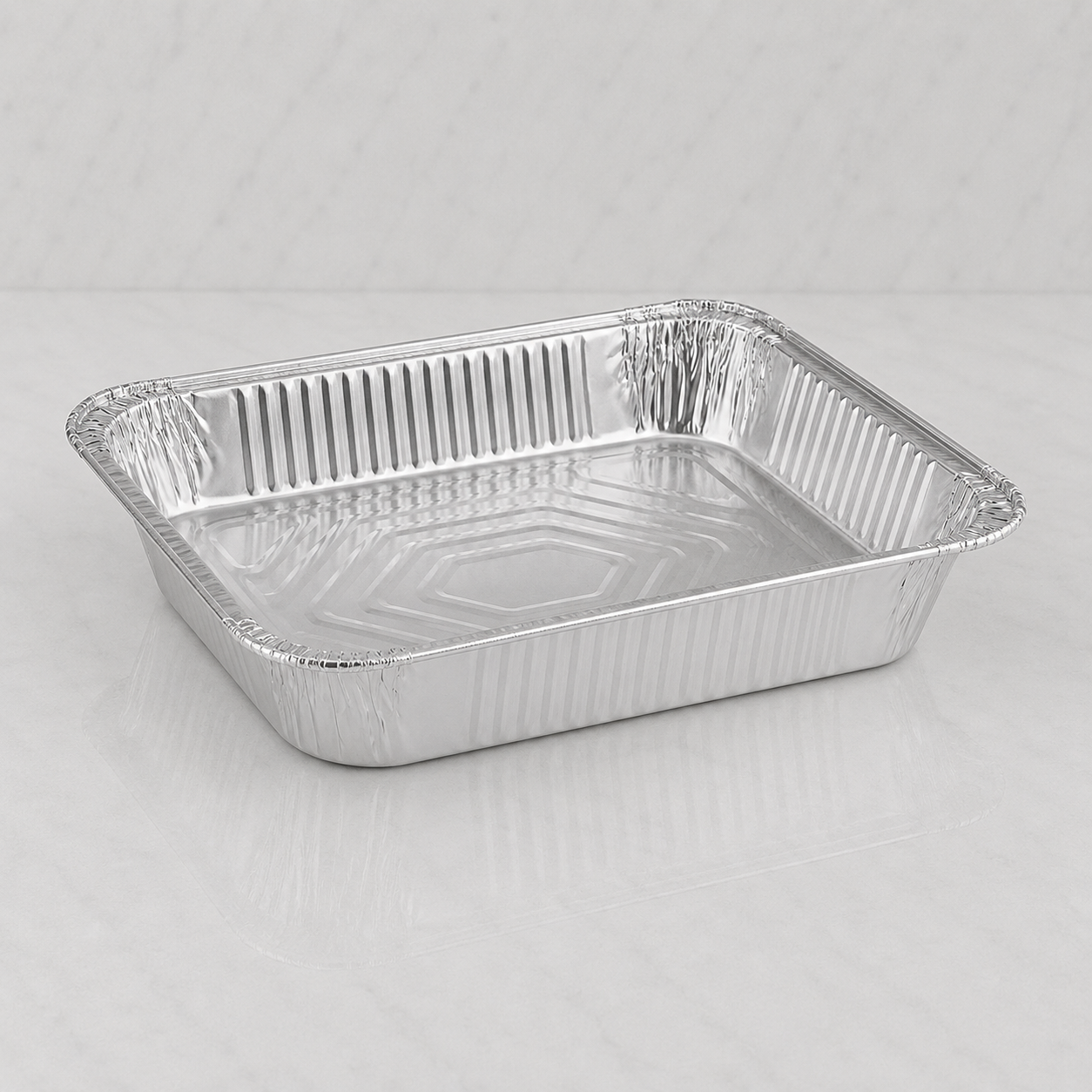 Aluminum foil pan on a gray background