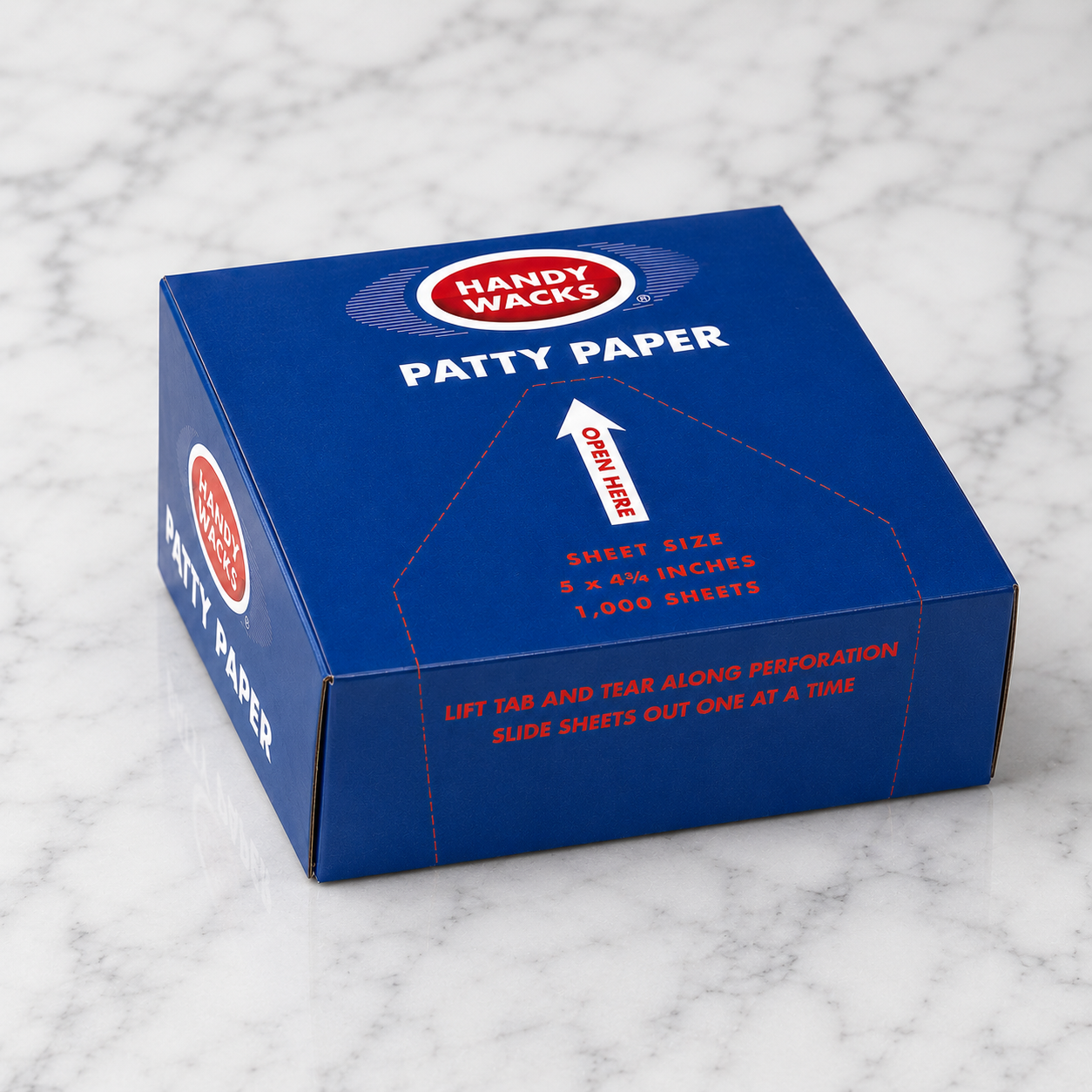 Box of Handy Wacks patty paper on a marble surface